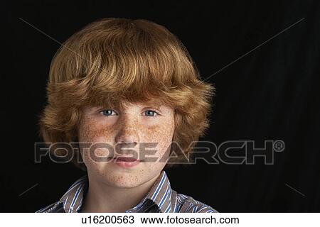 Boy (10-12) on black background portrait close-up View Large Photo Image Stock Image - Boy (10-12) on black background portrait close-up. Fotosearch