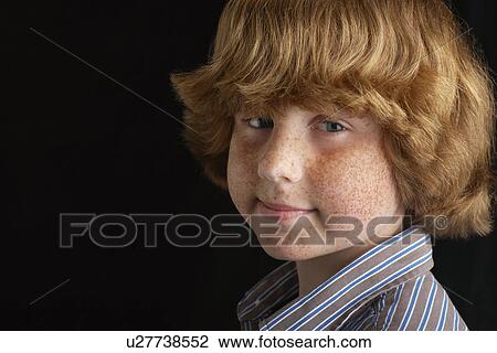 Boy (10-12) on black background portrait close-up View Large Photo Image Stock Image - Boy (10-12) on black background portrait close-up. Fotosearch