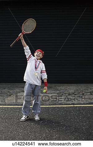 Stock Image - Boy winning tennis match. Fotosearch