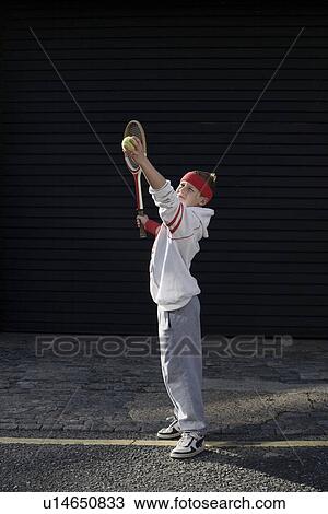 Stock Image - Boy with tennis rocket. Fotosearch