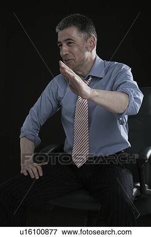 Stock Photo - Businessman Laughing and Gesturing. Fotosearch