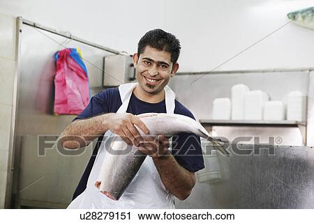 Butcher with Fresh Fish View Large Photo Image Stock Image - Butcher with Fresh Fish. Fotosearch