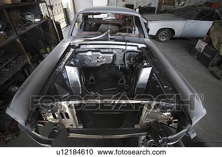 Stock Image - Car parts in garage. Fotosearch