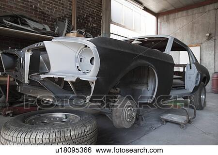 Stock Photograph - Car parts in garage. Fotosearch