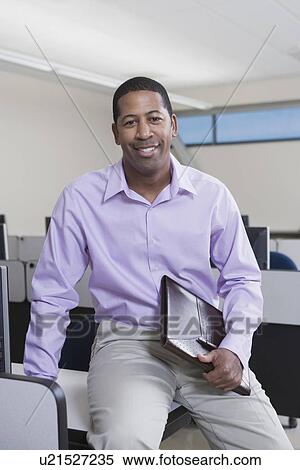 Stock Photography - Cheerful African American Businessman. Fotosearch