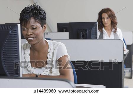 Cheerful African American Businesswoman Working on Computer View Large Photo Image Stock Image - Cheerful African American Businesswoman Working on Computer. Fotosearch