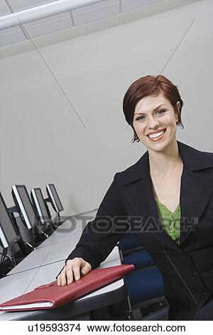 Cheerful Businesswoman Sitting at Desk Portrait View Large Photo Image Picture - Cheerful Businesswoman Sitting at Desk Portrait. Fotosearch