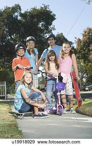 Stock Photo - Children with scooters and skateboard. Fotosearch