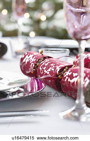 Christmas crackers on dining table View Large Photo Image Stock Photography - Christmas crackers on dining table. Fotosearch