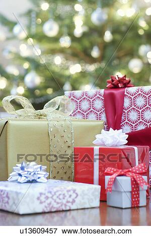Christmas presents on floor View Large Photo Image Stock Photo - Christmas presents on floor. Fotosearch