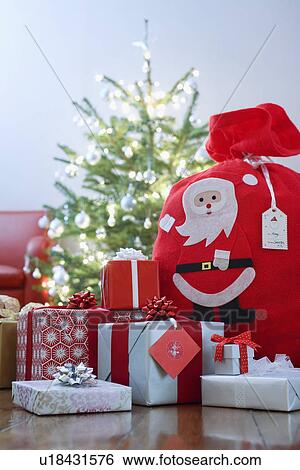 Christmas presents on floor View Large Photo Image Stock Photograph - Christmas presents on floor. Fotosearch