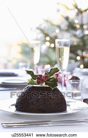 Christmas table with champagne and pudding View Large Photo Image Stock Image - Christmas table with champagne and pudding. Fotosearch