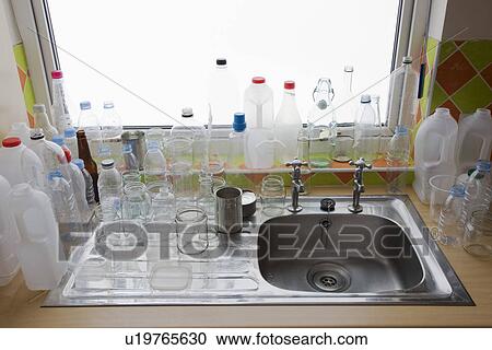 Clean bottles at kitchen sink View Large Photo Image Stock Image - Clean bottles at kitchen sink. Fotosearch
