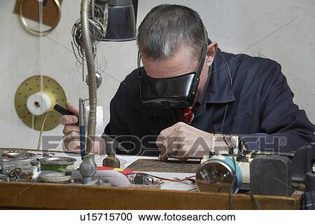 Clock Repairman at Work View Large Photo Image Stock Image - Clock Repairman at Work. Fotosearch