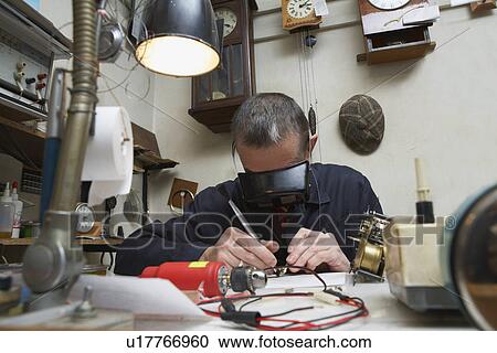Clock Repairman at Work View Large Photo Image Stock Image - Clock Repairman at Work. Fotosearch