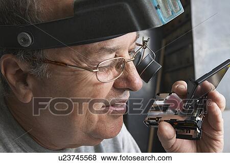 Clock Repairman at Work View Large Photo Image Stock Photo - Clock Repairman at Work. Fotosearch