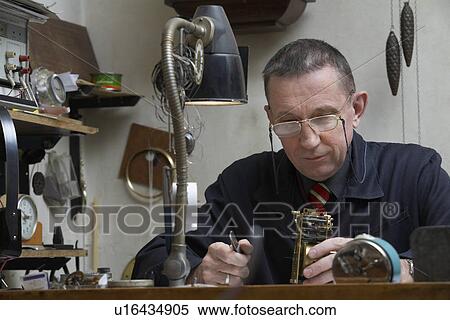 Clock Repairman at Work View Large Photo Image Stock Photography - Clock Repairman at Work. Fotosearch