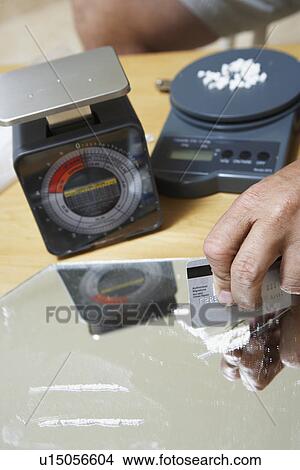 Close-up of man's hand and cocaine View Large Photo Image Picture - Close-up of man's hand and cocaine. Fotosearch