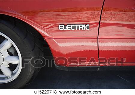 Stock Photo - Close up of sign on electric car. Fotosearch