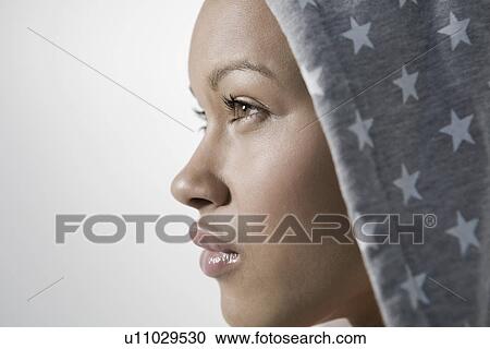 Stock Image - Close-up view of young woman profile. Fotosearch