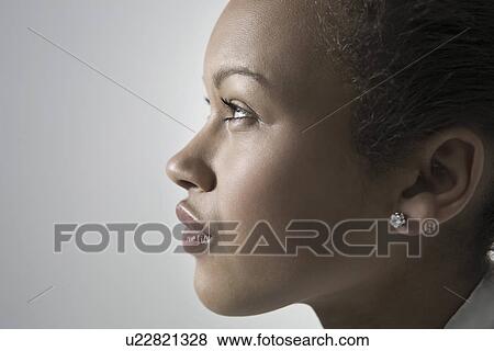 Close-up view of young woman profile View Large Photo Image Stock Photo - Close-up view of young woman profile. Fotosearch