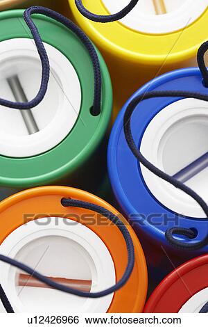 Stock Photograph - Colorful plastic money boxes view from above. Fotosearch