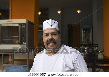 Cook in Commercial Kitchen View Large Photo Image Stock Photo - Cook in Commercial Kitchen. Fotosearch