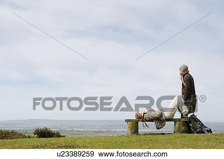 Couple Relaxing on a Park Bench View Large Photo Image Stock Photo - Couple Relaxing on a Park Bench. Fotosearch