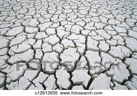Stock Photography - Cracked dry earth. Fotosearch
