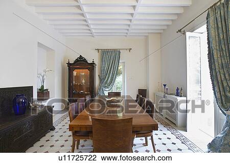 Stock Image - Cyprus dining room of colonial style house. Fotosearch