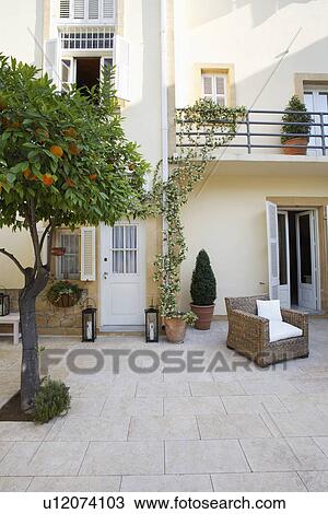 Stock Image - Cyprus terrace of colonial style house. Fotosearch