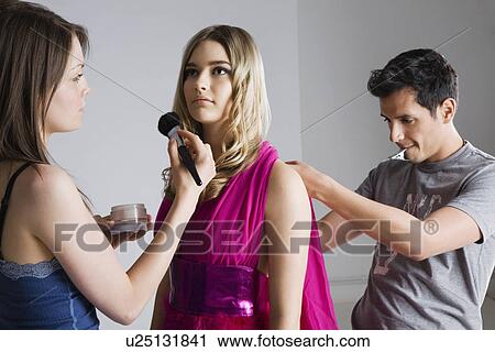 Designer and Makeup Artist Preparing Model for Photo Shoot View Large Photo Image Stock Image - Designer and Makeup Artist Preparing Model for Photo Shoot. Fotosearch