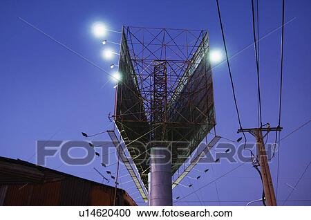 Stock Image - Double Billboard and Power Pole at Night. Fotosearch