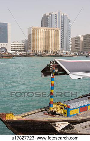 Stock Image - Dubai UAE An abra docked in Bur Dubai on Dubai Creek Deira.. Fotosearch