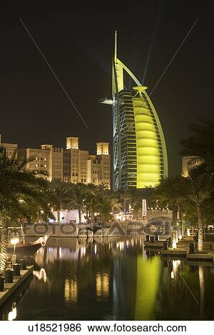 Dubai UAE colourfully lit world famous Burj Al Arab hotel Dubai icon View Large Photo Image Stock Photograph - Dubai UAE colourfully lit world famous Burj Al Arab hotel Dubai icon. Fotosearch