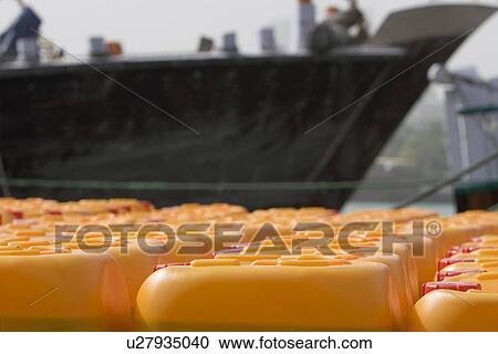 Dubai UAE Cooking oil waits to be loaded aboard a dhow headed for Iran or Somalia. View Large Photo Image Stock Image - Dubai UAE Cooking oil waits to be loaded aboard a dhow headed for Iran or Somalia.. Fotosearch