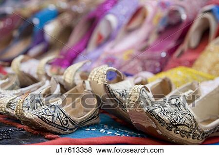 Dubai UAE Genie style sandals for sale in Bur Dubai souq in women’s and children’s sizes View Large Photo Image Stock Photo - Dubai UAE Genie style sandals for sale in Bur Dubai souq in women’s and children’s sizes. Fotosearch