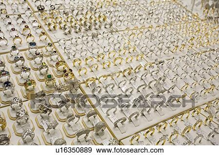 Dubai UAE Gold silver and diamond rings displayed Deira’s gold souq. View Large Photo Image Stock Photo - Dubai UAE Gold silver and diamond rings displayed Deira’s gold souq.. Fotosearch