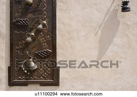 Dubai UAE Ornately decorated wood doors at Heritage Village in Bur Dubai View Large Photo Image Picture - Dubai UAE Ornately decorated wood doors at Heritage Village in Bur Dubai. Fotosearch