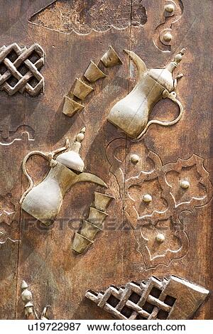 Dubai UAE Ornately decorated wood doors at Heritage Village in Bur Dubai View Large Photo Image Stock Photo - Dubai UAE Ornately decorated wood doors at Heritage Village in Bur Dubai. Fotosearch