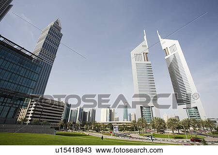 Dubai UAE view of Emirates Towers on Sheikh Zayed Road View Large Photo Image Stock Image - Dubai UAE view of Emirates Towers on Sheikh Zayed Road. Fotosearch