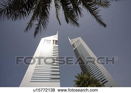 Stock Photo - Dubai UAE View of Emirates Towers on Sheikh Zayed Road in Dubai. Fotosearch
