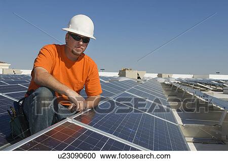 Electrical Engineer Among Solar Panels at Solar Power Plant View Large Photo Image Stock Image - Electrical Engineer Among Solar Panels at Solar Power Plant. Fotosearch