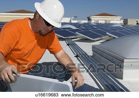 Electrical Engineer Working at Solar Power Plant View Large Photo Image Stock Image - Electrical Engineer Working at Solar Power Plant. Fotosearch