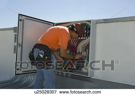 Engineer Working on Electrical Box at Solar Power Plant View Large Photo Image Stock Photo - Engineer Working on Electrical Box at Solar Power Plant. Fotosearch