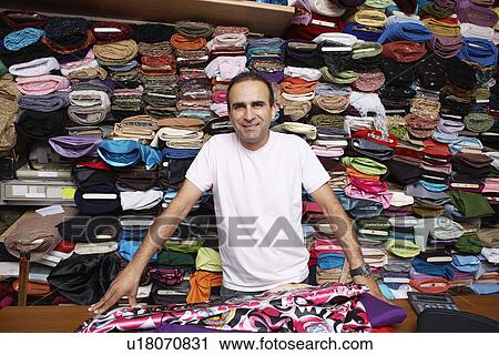 Stock Image - Fabric Store Worker. Fotosearch