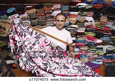 Stock Photography - Fabric Store Worker. Fotosearch