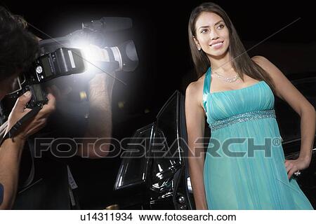 Female celebrity being photographed at media event View Large Photo Image Picture - Female celebrity being photographed at media event. Fotosearch