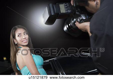 Female celebrity being photographed at media event View Large Photo Image Stock Photo - Female celebrity being photographed at media event. Fotosearch