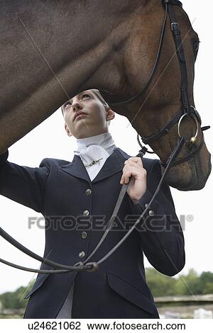 Female horseback rider with horse outdoors View Large Photo Image Stock Image - Female horseback rider with horse outdoors. Fotosearch